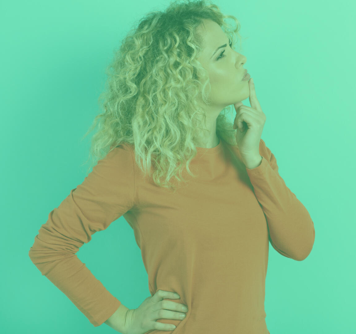 confused woman with finger on chin